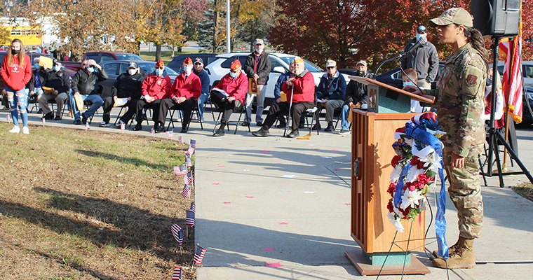 Veteran speaks at podium