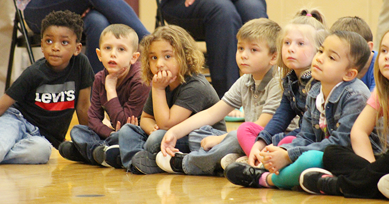 Students sitting on the floor