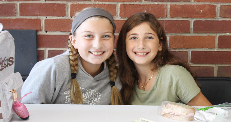 Two students smiling