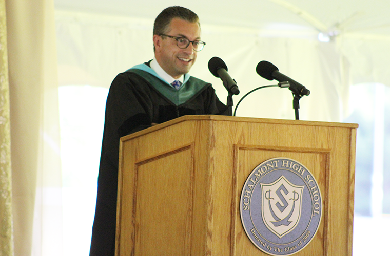 Superintendent Dr. Reardon stands at podium