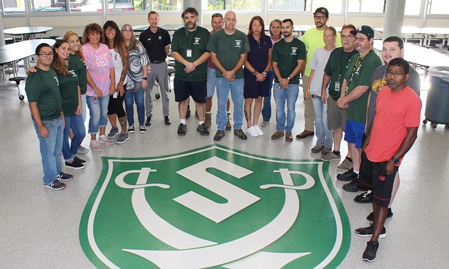 Facilities staff stands for group photo