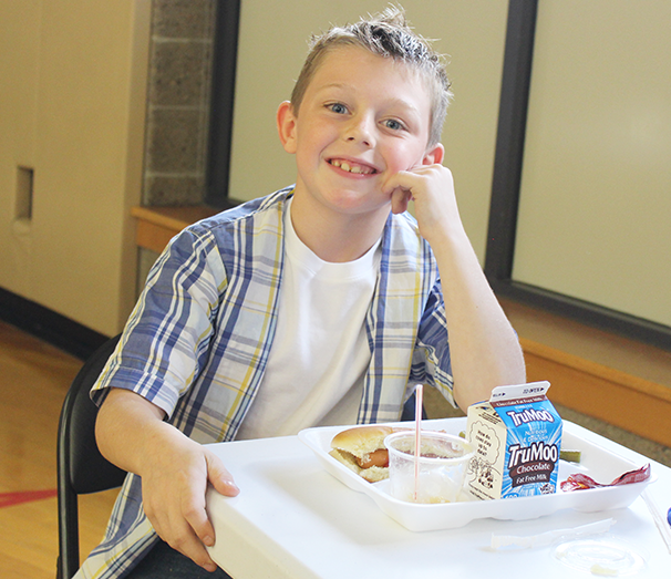 Student with school lunch