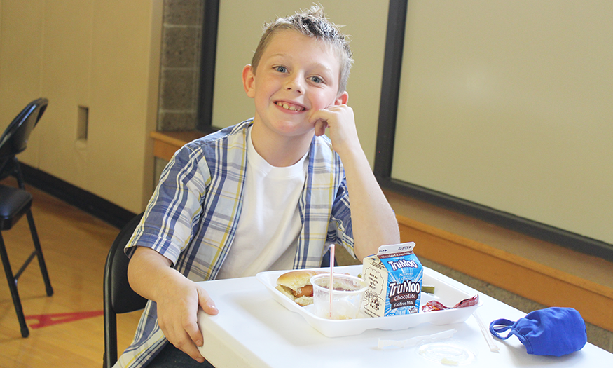 Student with school lunch