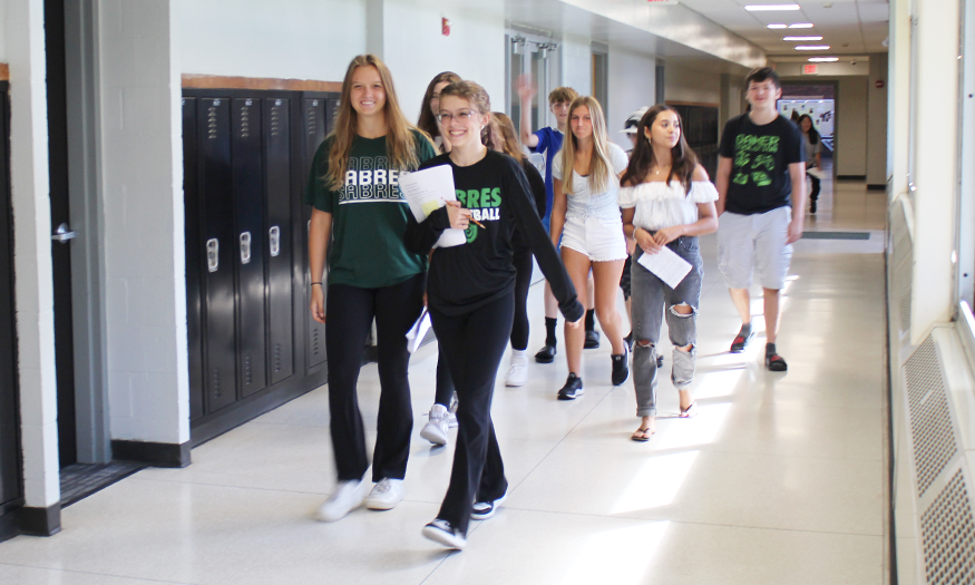 Students lead tour through hallway