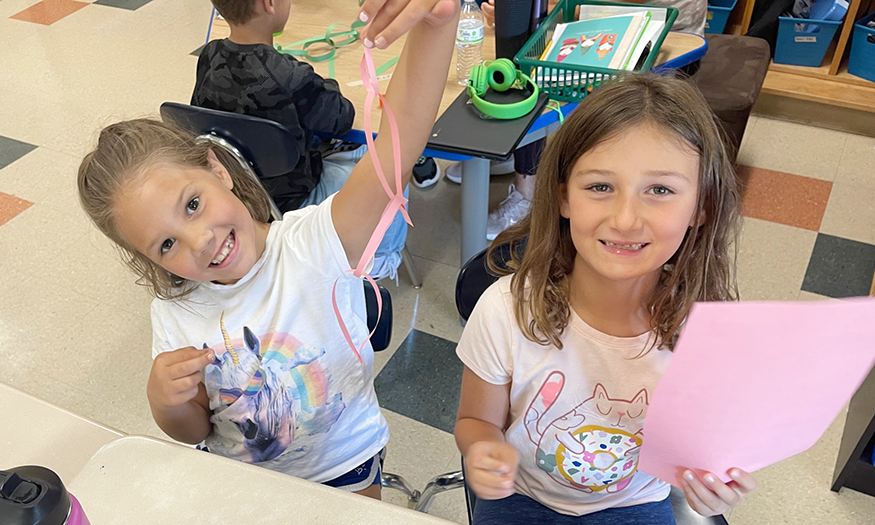 Students work on paper chain