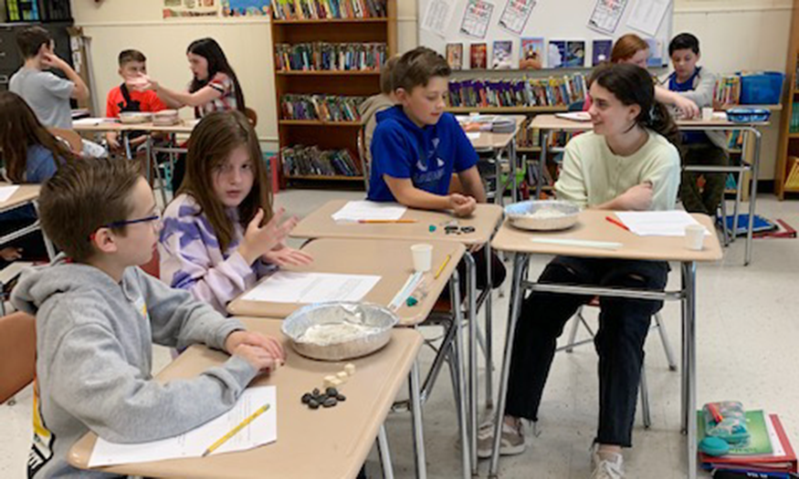 Students at desks talking