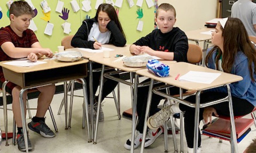 Students at desks talking