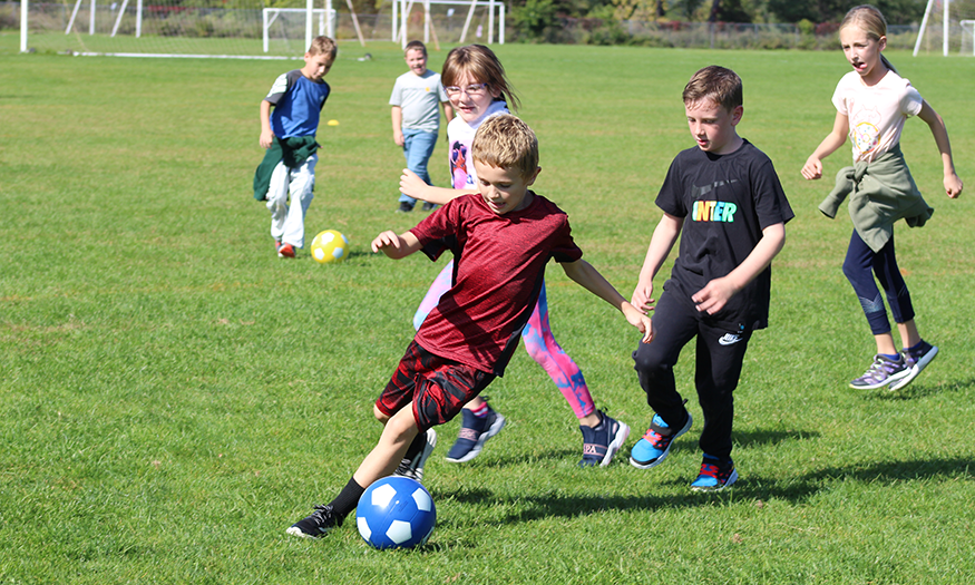 Students play soccer