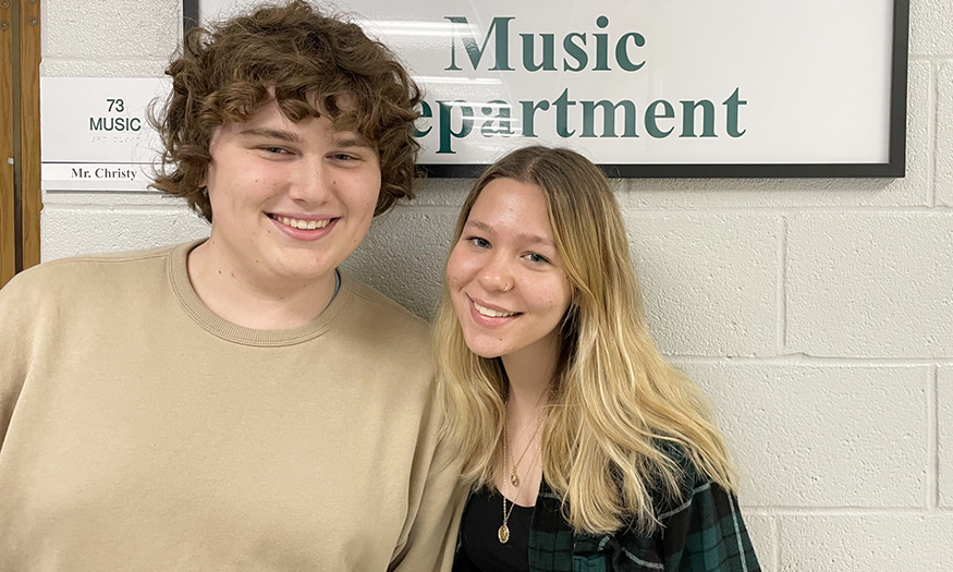 Two students pose for a photo