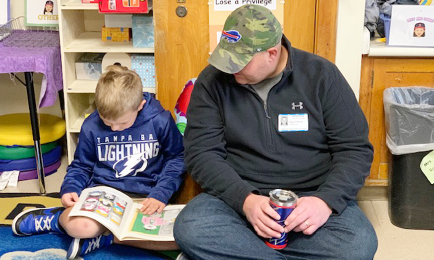 Parent reads with student