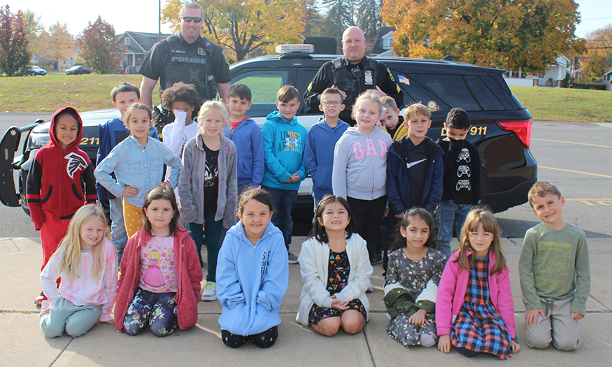 Students in group photo with police