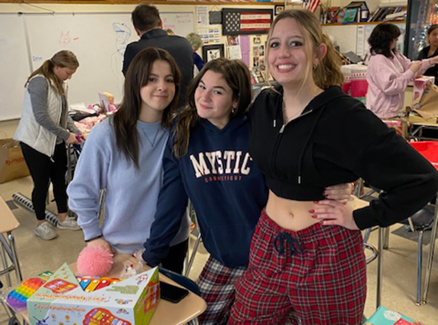 Students wrap presents in classroom