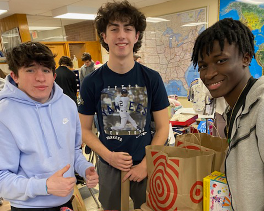 Students wrap presents in classroom