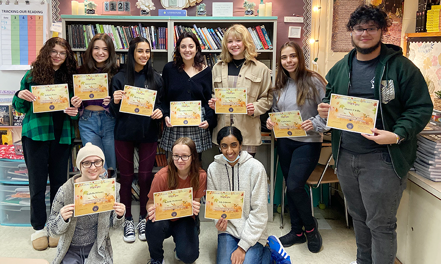 Group photo of students holding certificates