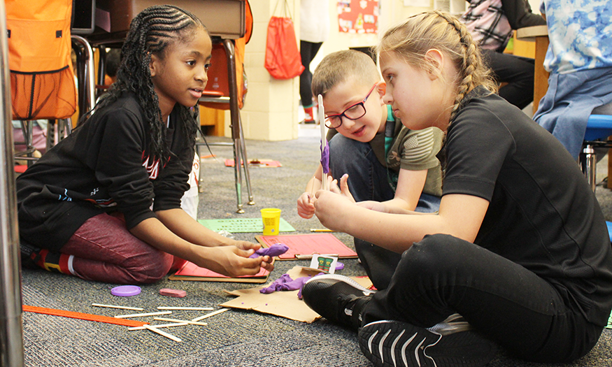 Students work on the floor