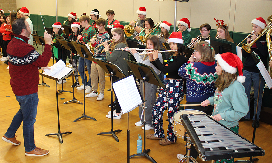 Student musicians perform in gym