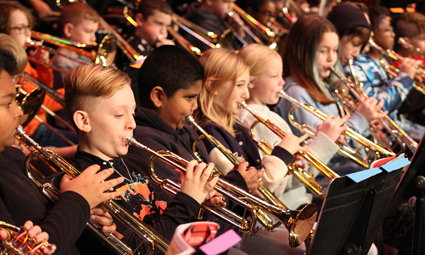 Students play trumpets