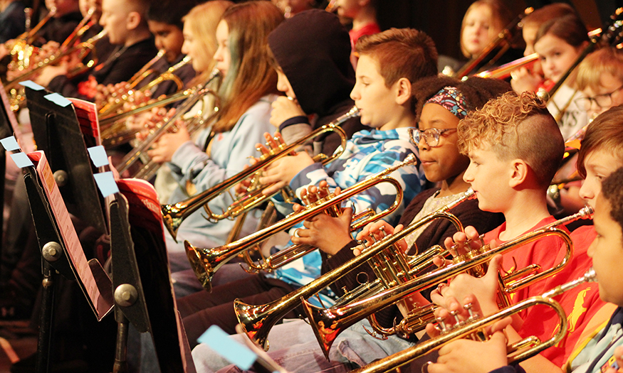 Students play trumpets