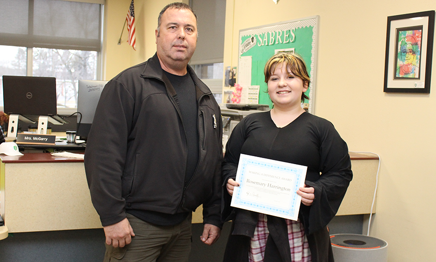 Student with certificate and police officer