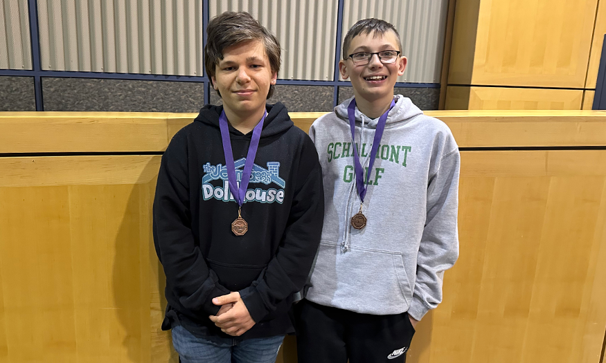 Two students with medals