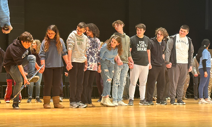 Students in line on stage
