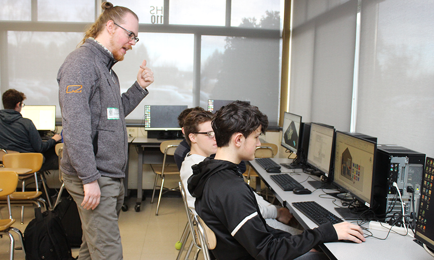 Architectural Designer works with students