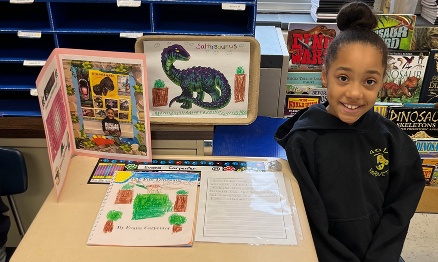 Student with dinosaur project