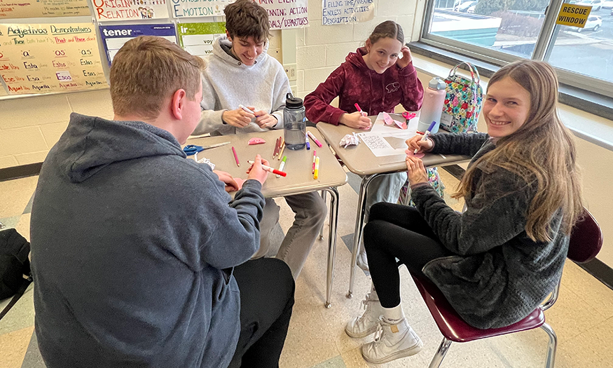 Students work on project at desks