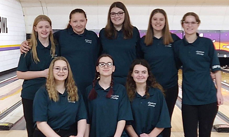 Girls bowling team pose for photo