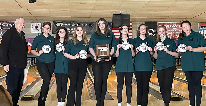 Girls bowling team pose for photo