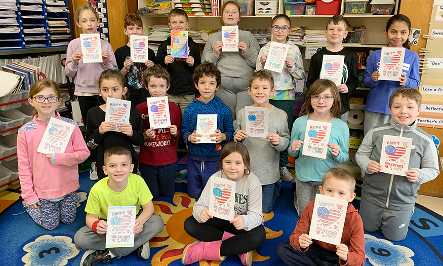 Group of students with Valentine's Day cards