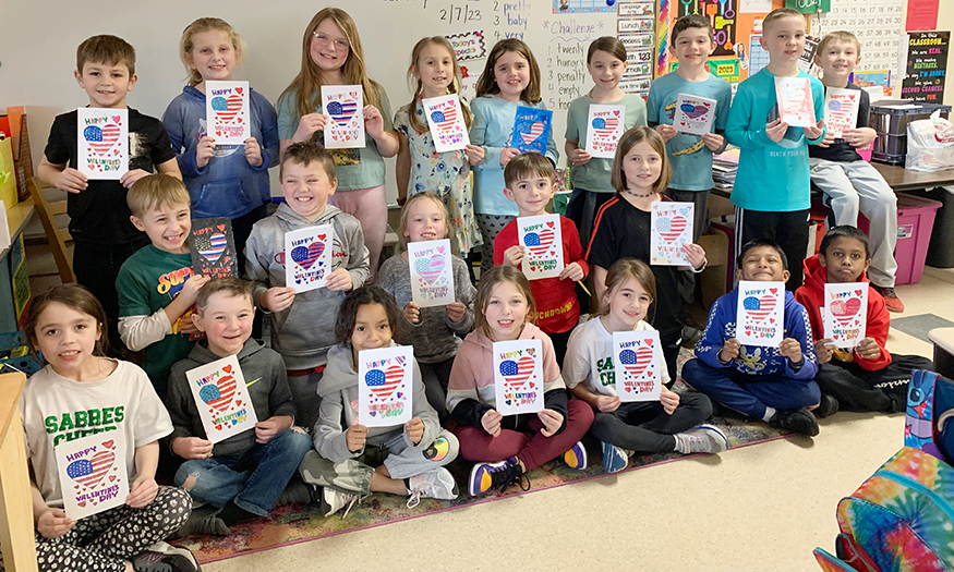 Group of students with Valentine's Day cards