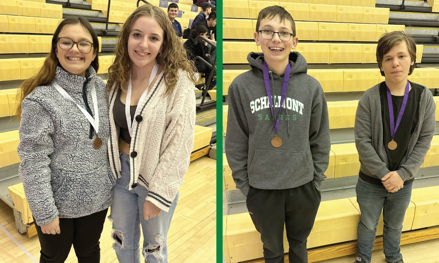 Two pairs of students pose for photo with medals