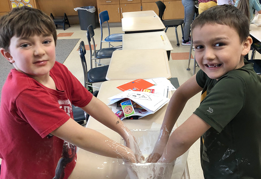 Students with science experiment