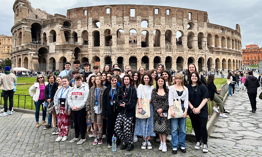 Group photo of students in front of Colliseum