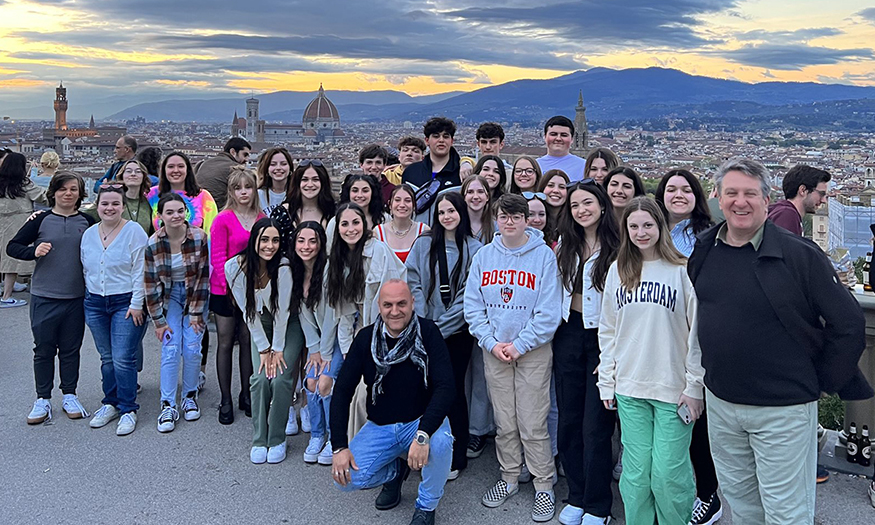 Group photo of high school students at sunset