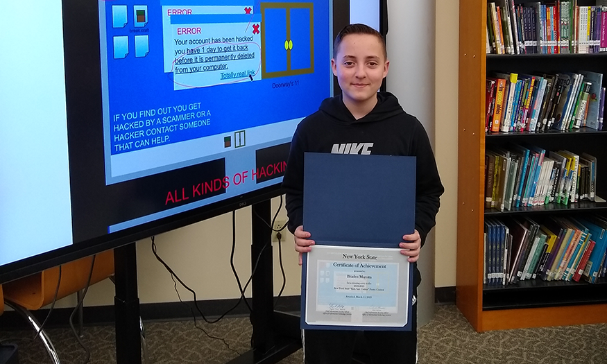 Student stands with award