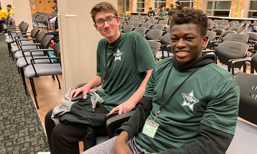 Two high school seniors pose for photo