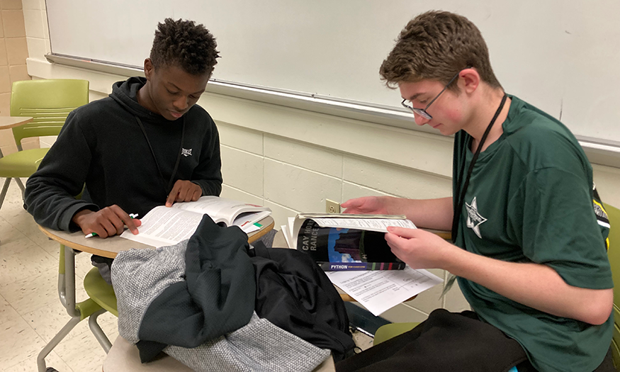 Two high school seniors study