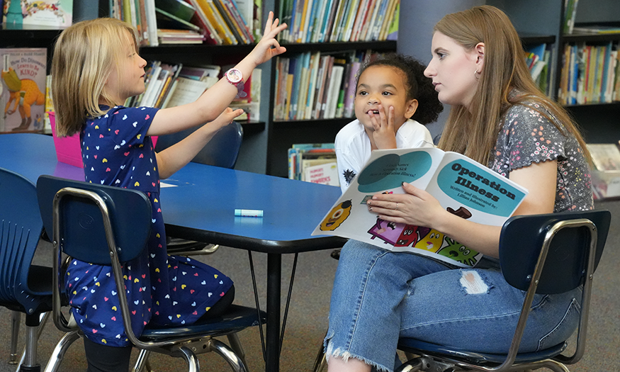 Student reads to students