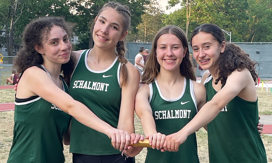 Girls relay team poses for photo