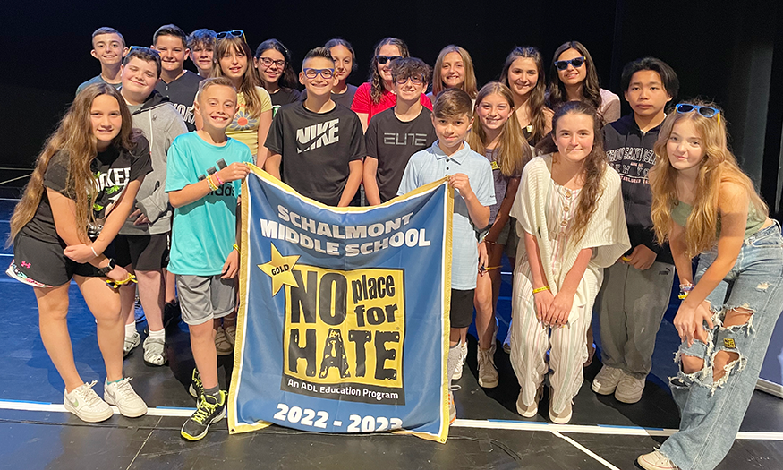 Group photo of students holding No Place for Hate banner