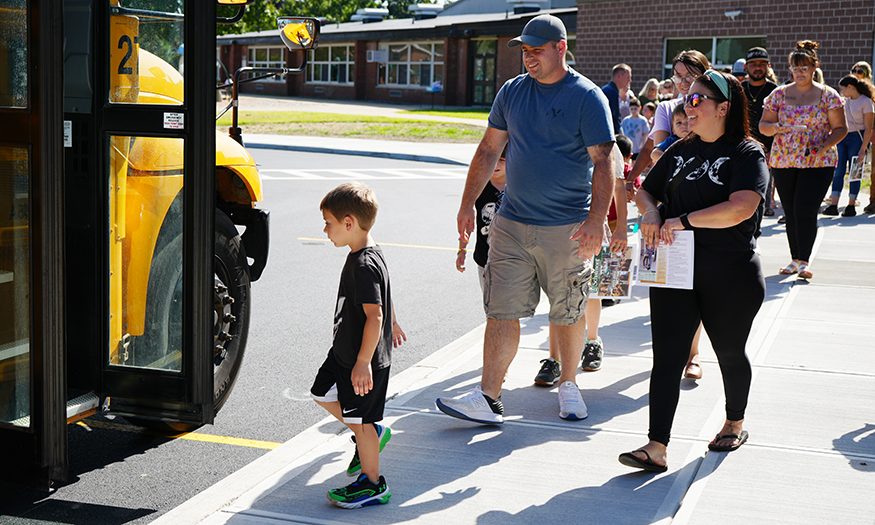 Family gets on school bus