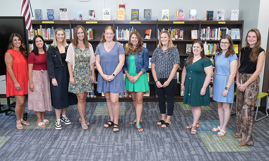 Group photo of faculty in library