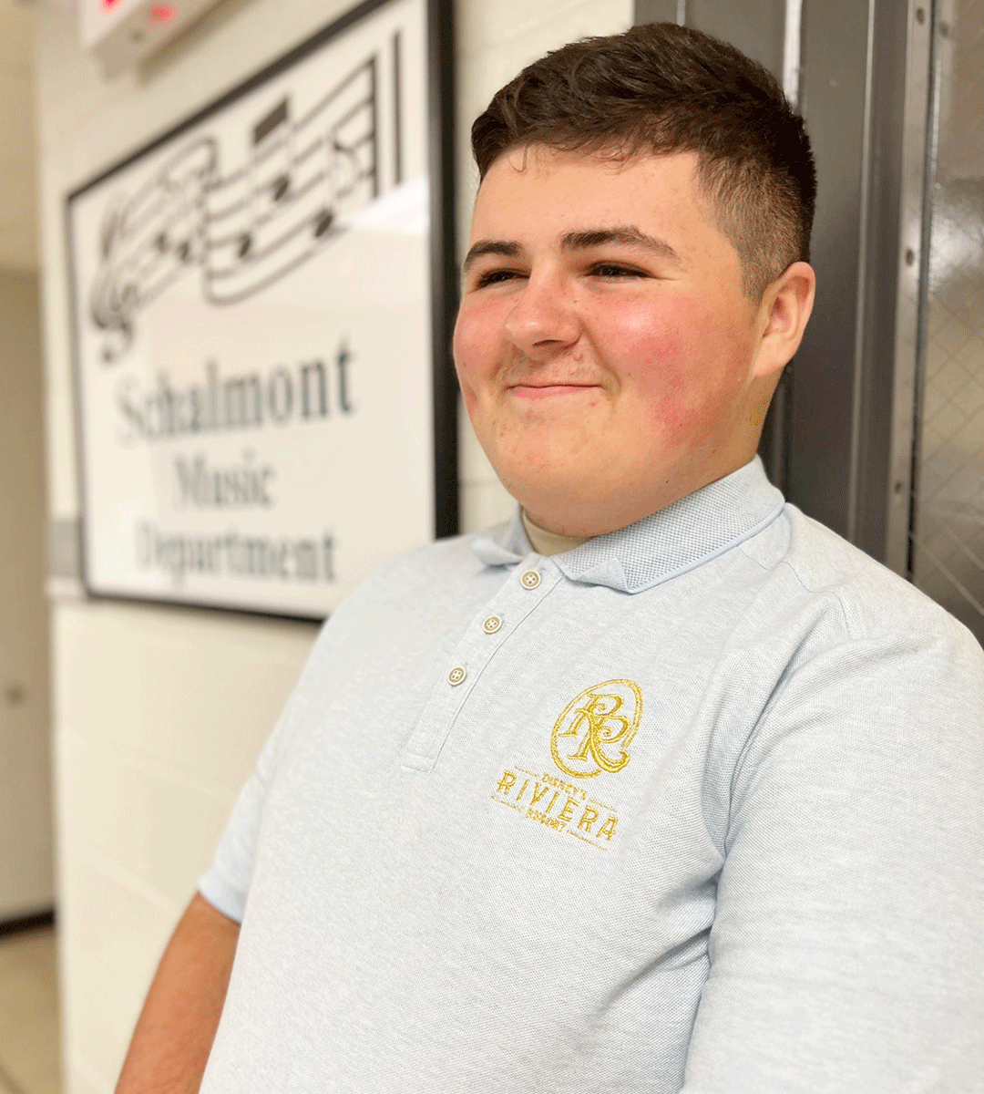 Photo of High School senior in front of music sign