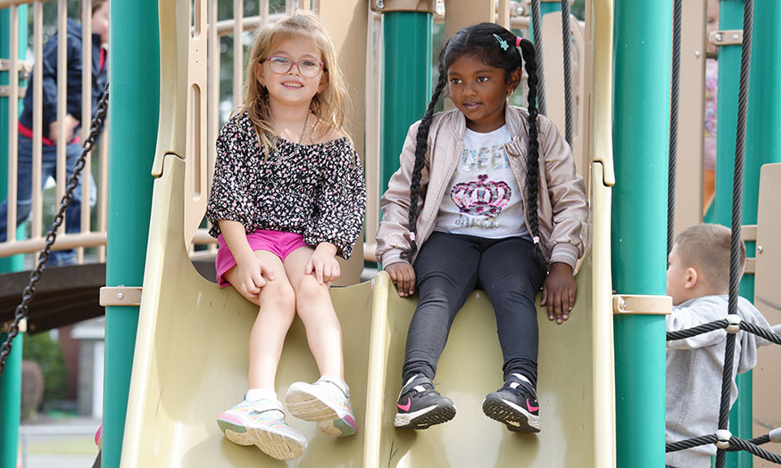 Student young girls on slides