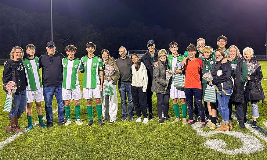 Group photo of soccer players and families