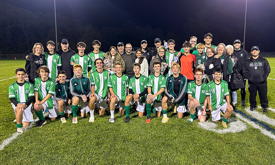 Group photo of soccer players and families