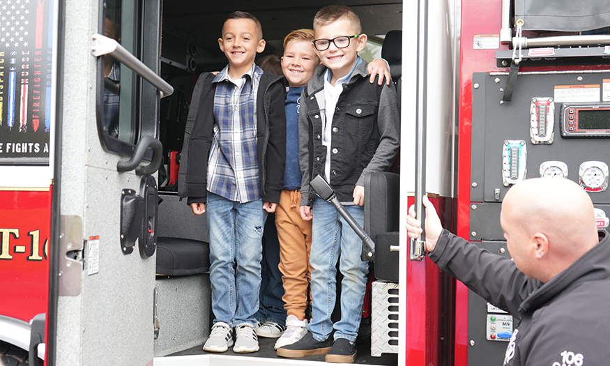 Group photo of students in fire truck