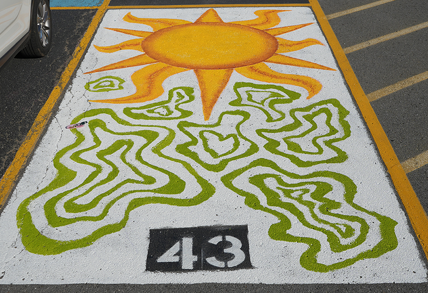Parking spot painted with sun